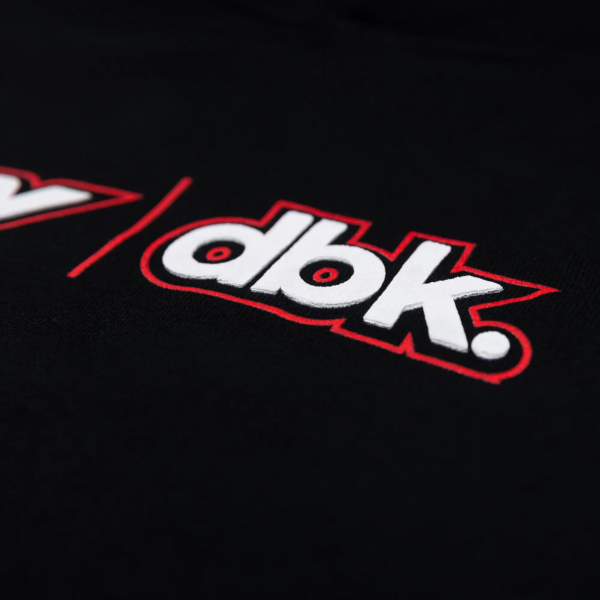 Youth black hoodie with FLY dbk logo, worn by person