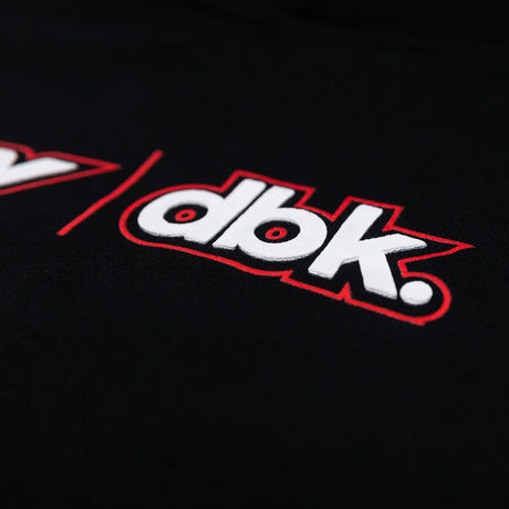Close-up of FLY dbk logo patch on black youth hoodie