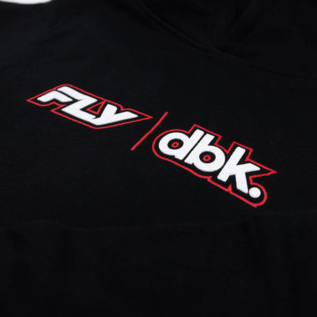 Close-up of FLY dbk logo on black youth hoodie