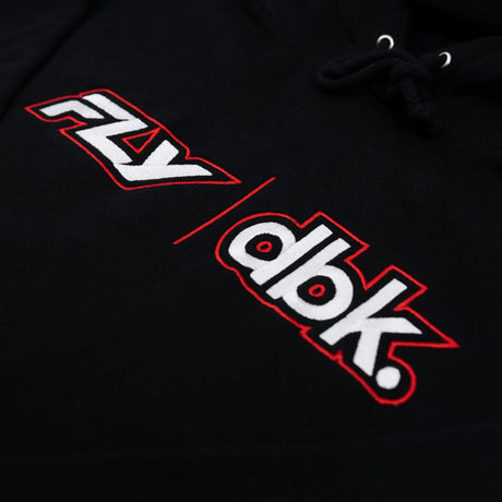 Black hoodie logo closeup: FLY and dbk lettering with red outlines