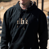Dark hoodie with cream lettering graphic and adjustable drawstring hood