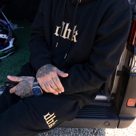 Black Monte Carlo hoodie with front logo and logo on left pant leg area