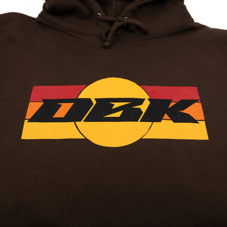 Brown hoodie with drawstring and large yellow/black DBK logo on the chest