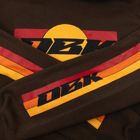 Brown youth hoodie close-up of sleeve stripe with DKB lettering in orange and red