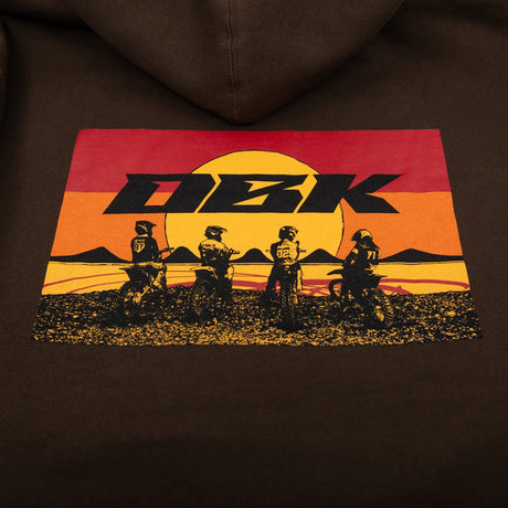 Brown youth hoodie close-up of back graphic with DKB text and silhouettes