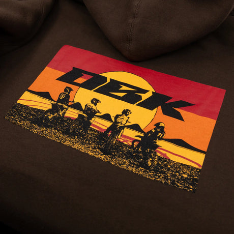 Dark brown hoodie with yellow DBK logo graphic and red-orange stripe on the sleeve