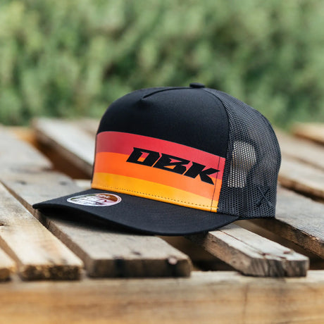DBK 2Fifty trucker hat, black front and mesh side panels with orange-red stripe