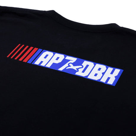 Black youth T-shirt sleeve? chest close-up of blue AP7-DBH striped logo graphic.