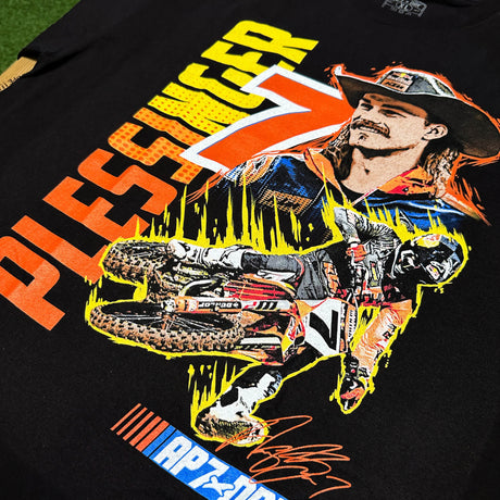 Youth black T-shirt close-up of colorful rider and AP7 graphics, including signature.
