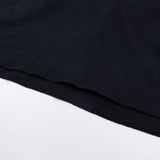 Women's black T-shirt sleeve hem and knit texture detail