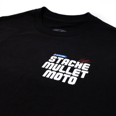 Black youth premium tee with “STACHE MULLET MOTO” graphic across the chest