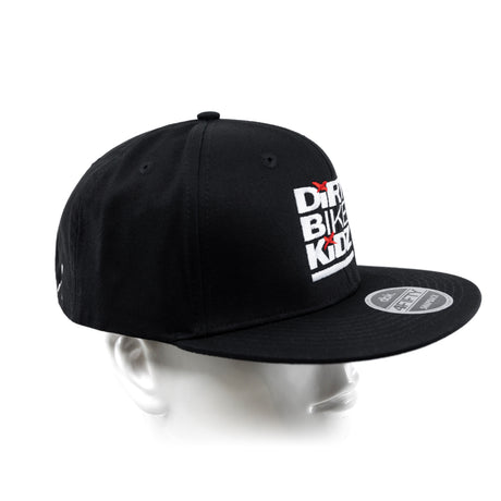 Black snapback cap with white side logo patch, red accents, and curved brim