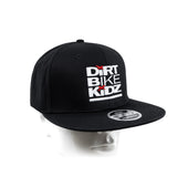 Black snapback hat with Dirt Bike Kidz front logo, side emblem patch, curved brim