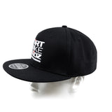 Black snapback cap from side angle with partial front logo graphic.