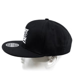Black snapback cap from back-left angle with side sticker patch.