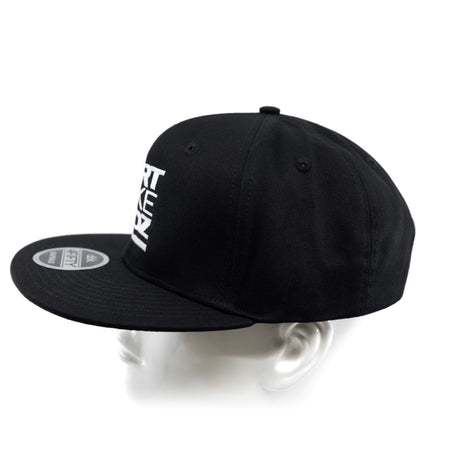 Black snapback cap from back-left angle with side sticker patch.