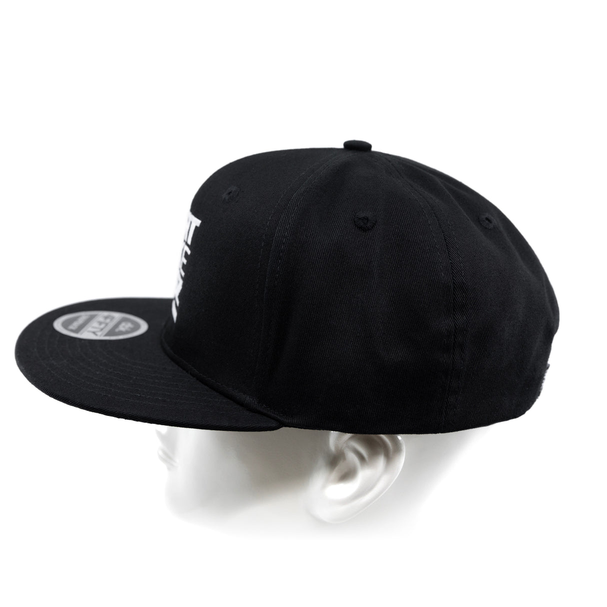 Black snapback cap from back angle with visible eyelets on crown.