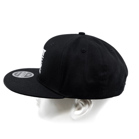 Black snapback cap from back angle with visible eyelets on crown.