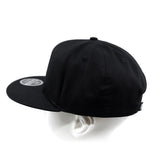 Black snapback cap from back-left angle with side panel and eyelets.
