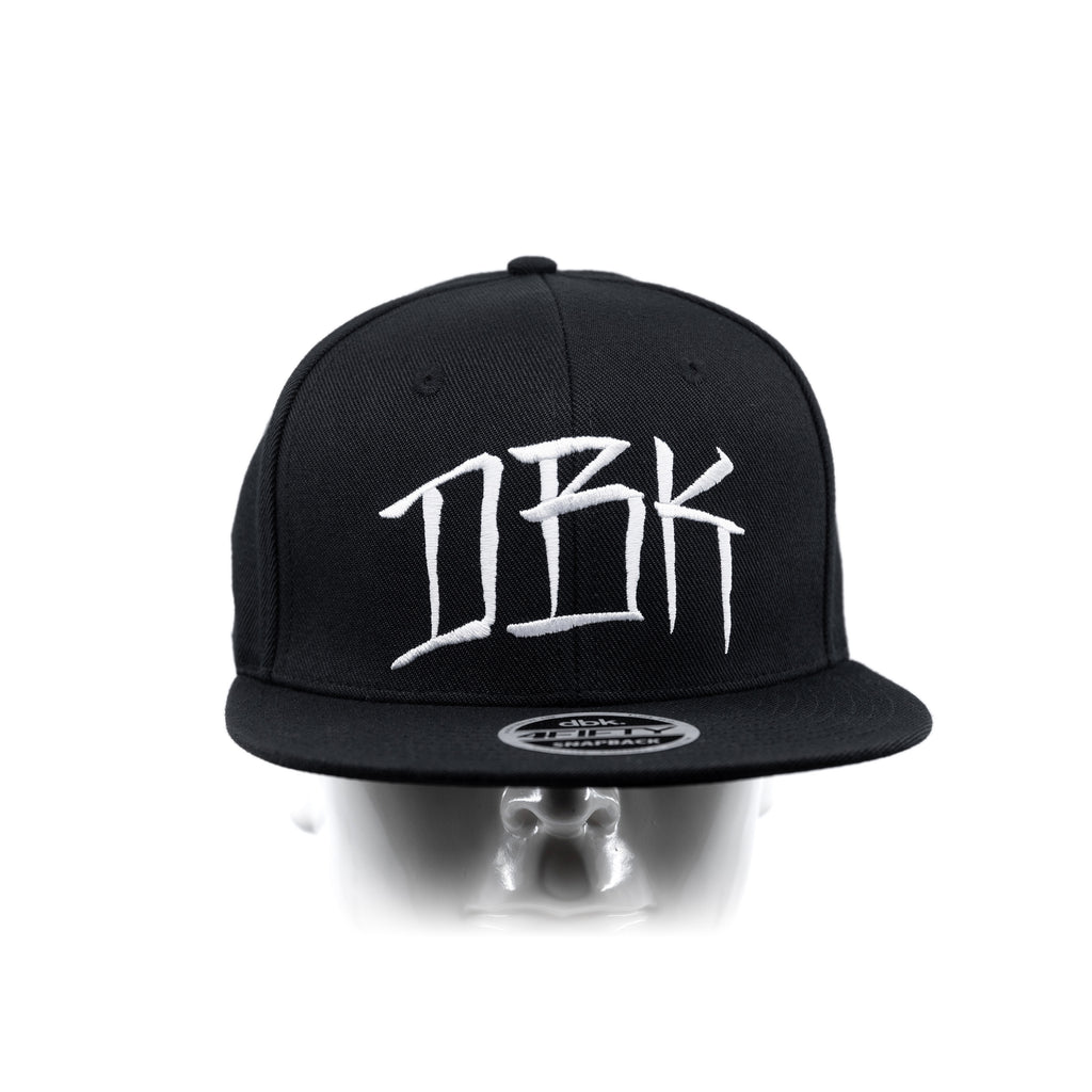 Black snapback cap front view on head mannequin with DBK logo and brim patch
