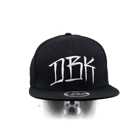 Black snapback cap front view on head mannequin with DBK logo and brim patch