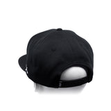 Black baseball cap with adjustable back strap and curved brim, side view