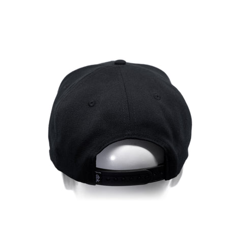Black snapback cap with curved brim, stitched panels, and adjustable back strap