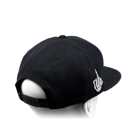 Black snapback cap with curved brim and white hand emblem on the side