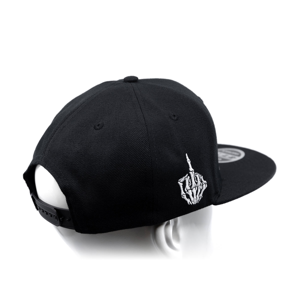 Black snapback cap with curved brim and white hand emblem embroidery