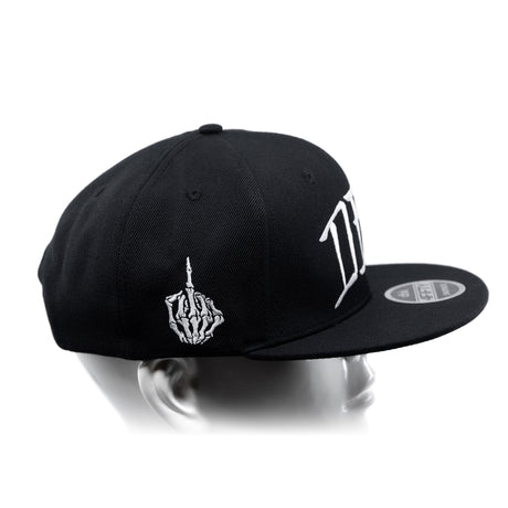 Black snapback cap with curved brim, white hand emblem, and large side lettering