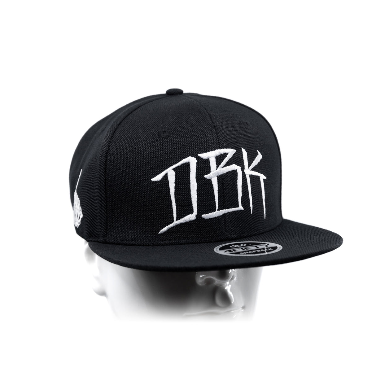 Black snapback cap with large white DBK lettering on front