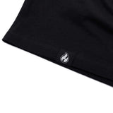 Black T-shirt hem with small flame logo patch