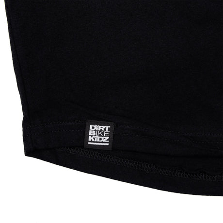 Black T-shirt with DIRT BIKE KIDZ label at hem