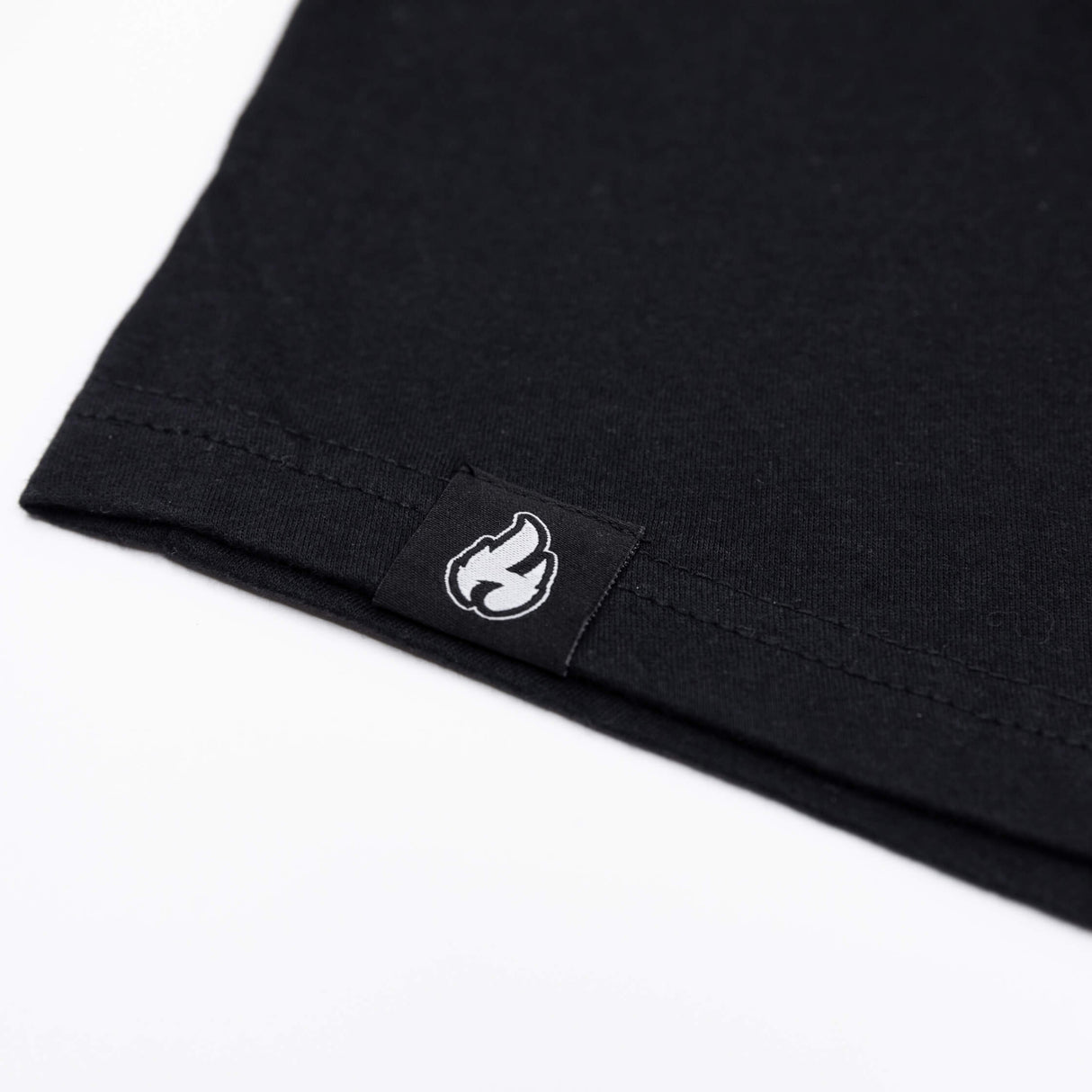 Black tank top hem with white flame icon patch
