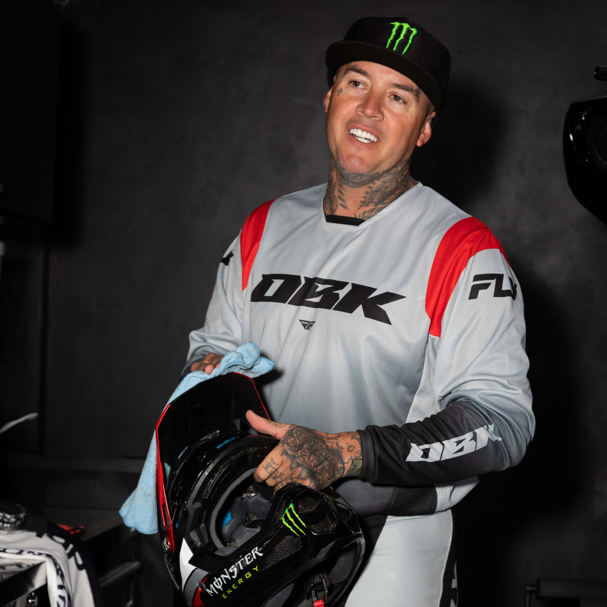 Kinetic DBK jersey with light gray body, red shoulder panel, and black logo sleeve