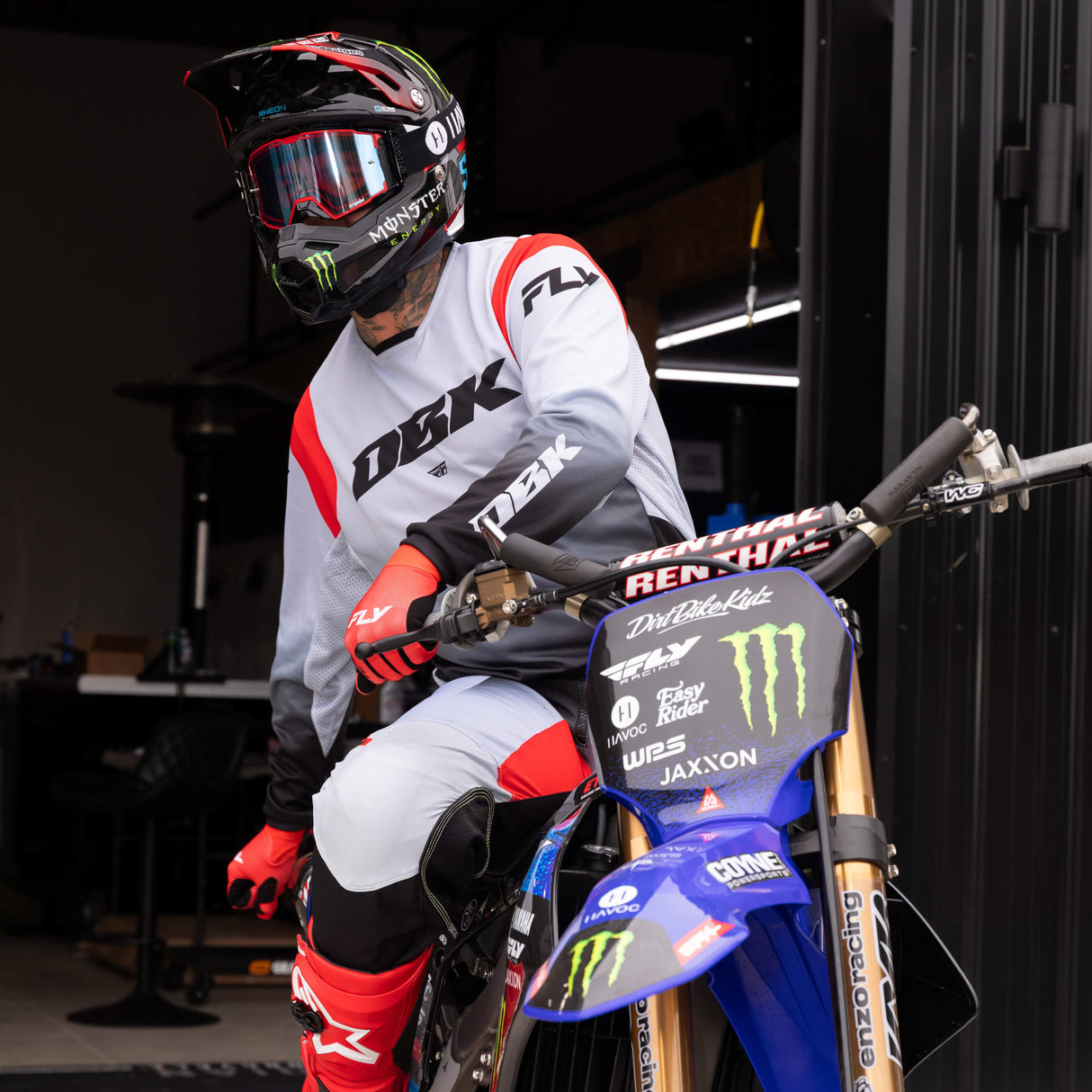 Motocross jersey in white and black with red side panel accents and DBK logo on chest