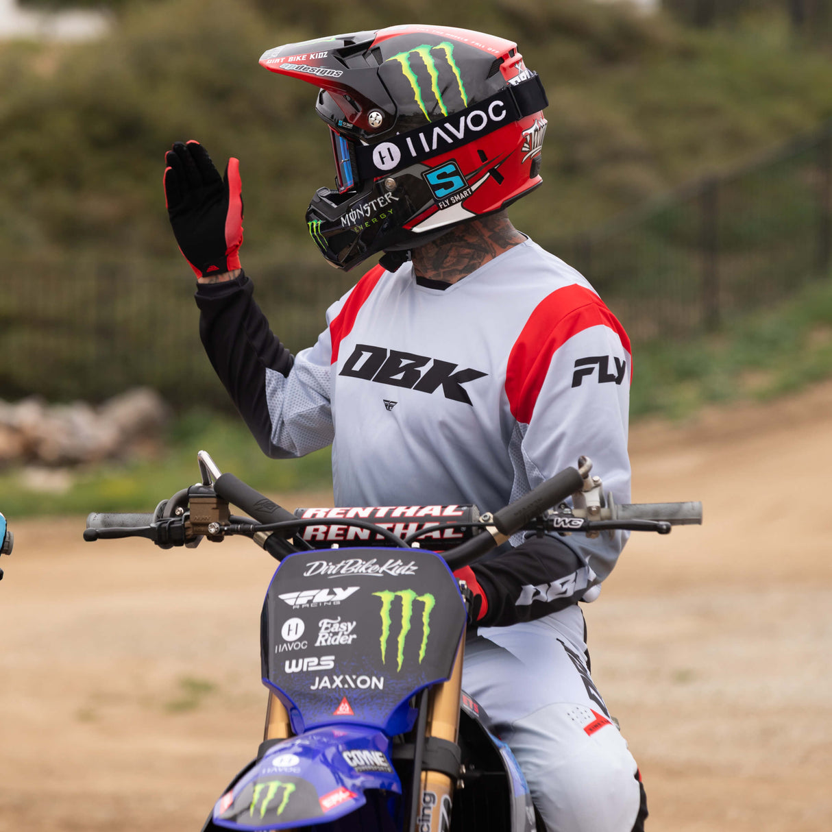 Black and red motocross riding pants with DRK logo and knee panel details