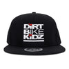 Black snapback hat with Dirt Bike Kidz logo patch on front.