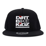 Black snapback hat with Dirt Bike Kidz logo patch on front.