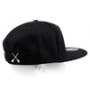 Black snapback hat with white X logo on the back panel.