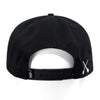 Black snapback hat with side strap and white X detail near the brim.