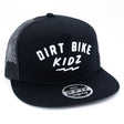 Black trucker cap with white 'DIRT BIKE KIDZ' front print, mesh side panels