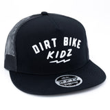Black trucker cap with white 'DIRT BIKE KIDZ' front print, mesh side panels