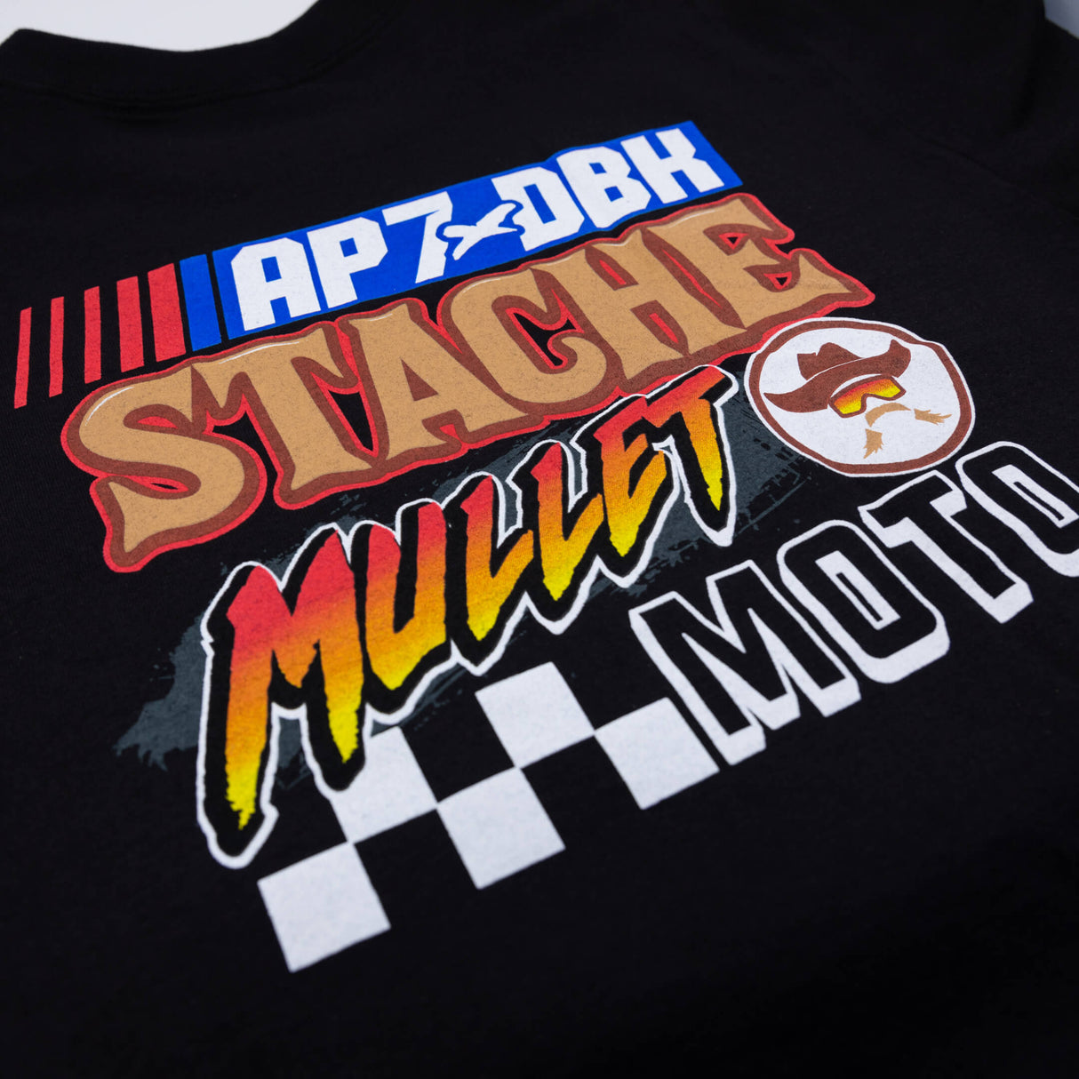 Black graphic T-shirt with AP7 and Stache graphic on front