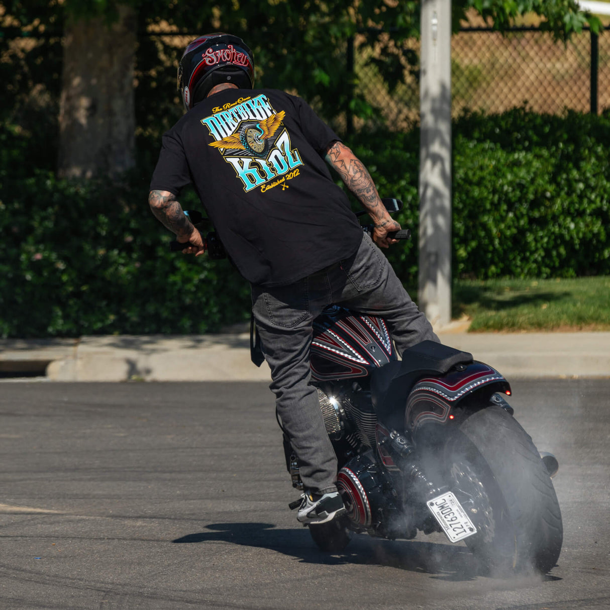Black tee close-up with 'Dirtbike Kidz' back graphic