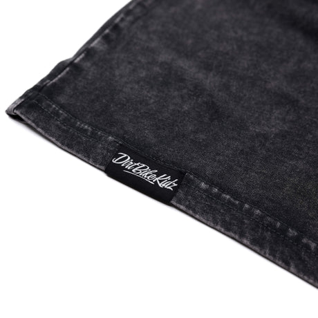 Dark tank top hem with stitched inner label