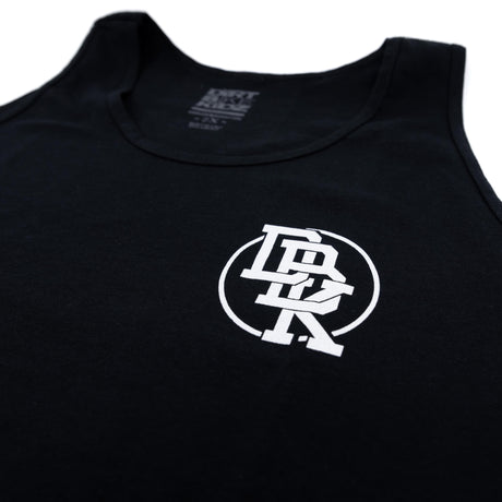 Black youth tank top with small circular 'DBK' emblem centered on chest.