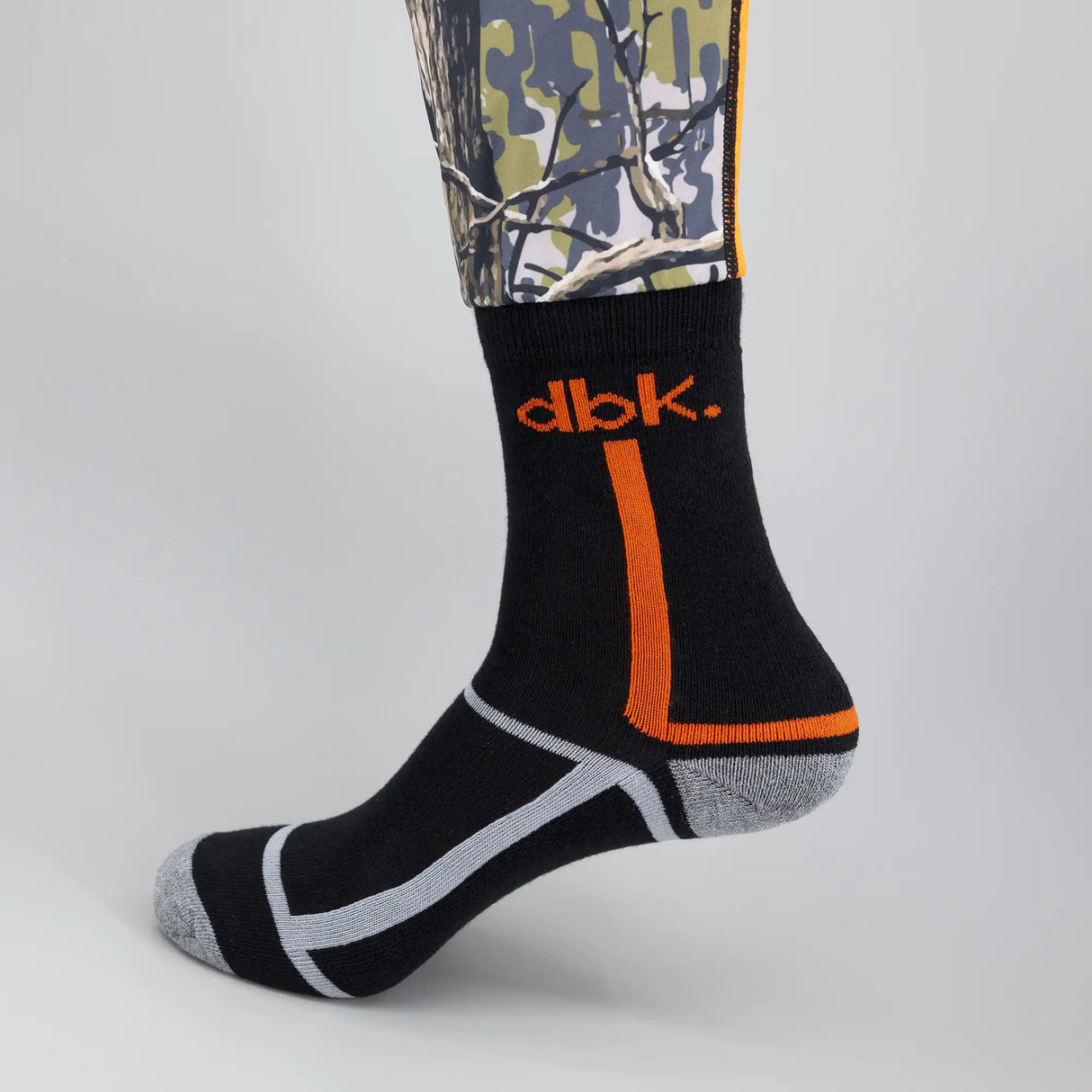 Black moto sock with orange vertical stripe, white heel/toe lines, gray sole.