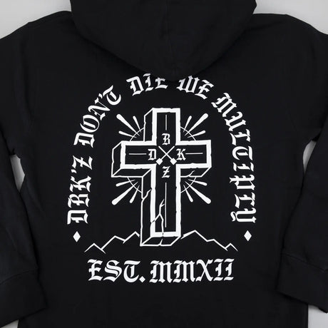 Black hoodie back graphic with white cross emblem and arched text below.
