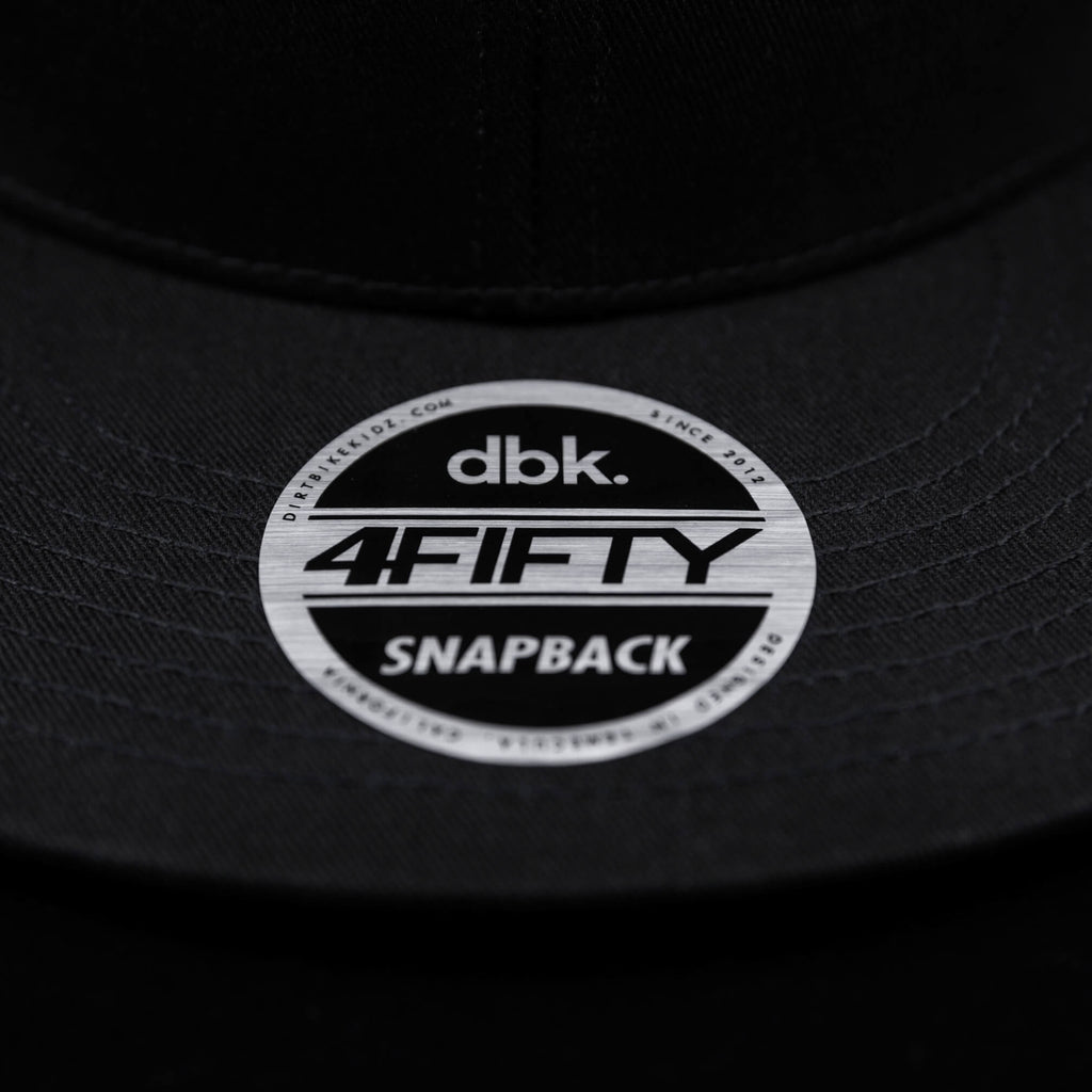 Black snapback cap underside with dbk 4FIFTY snapback circular patch